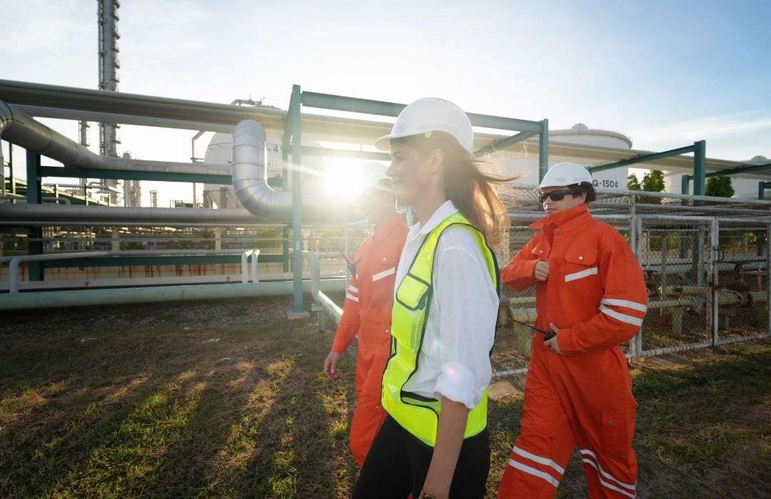 oil and gas workers discussing chemical management systems