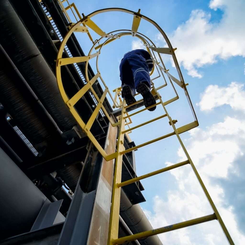 oil and gas worker climbing